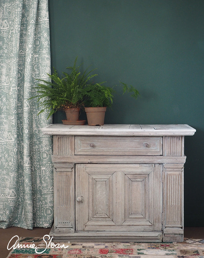 Painted cabinet and green wall